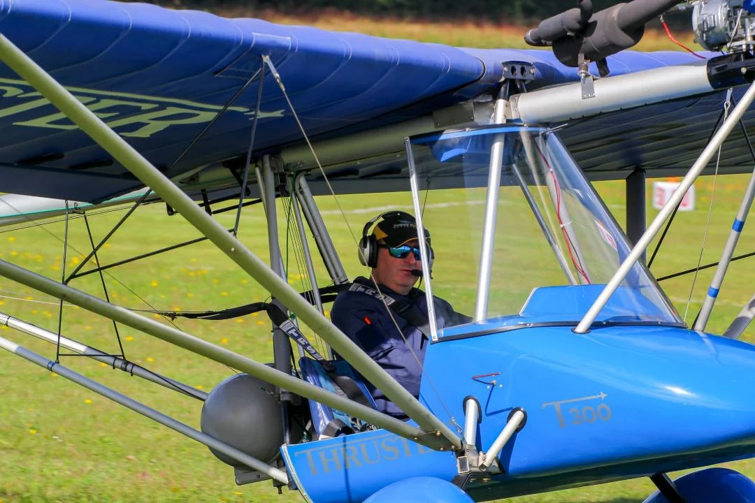 Simon Wilson in the open cockpit of his Thruster T300